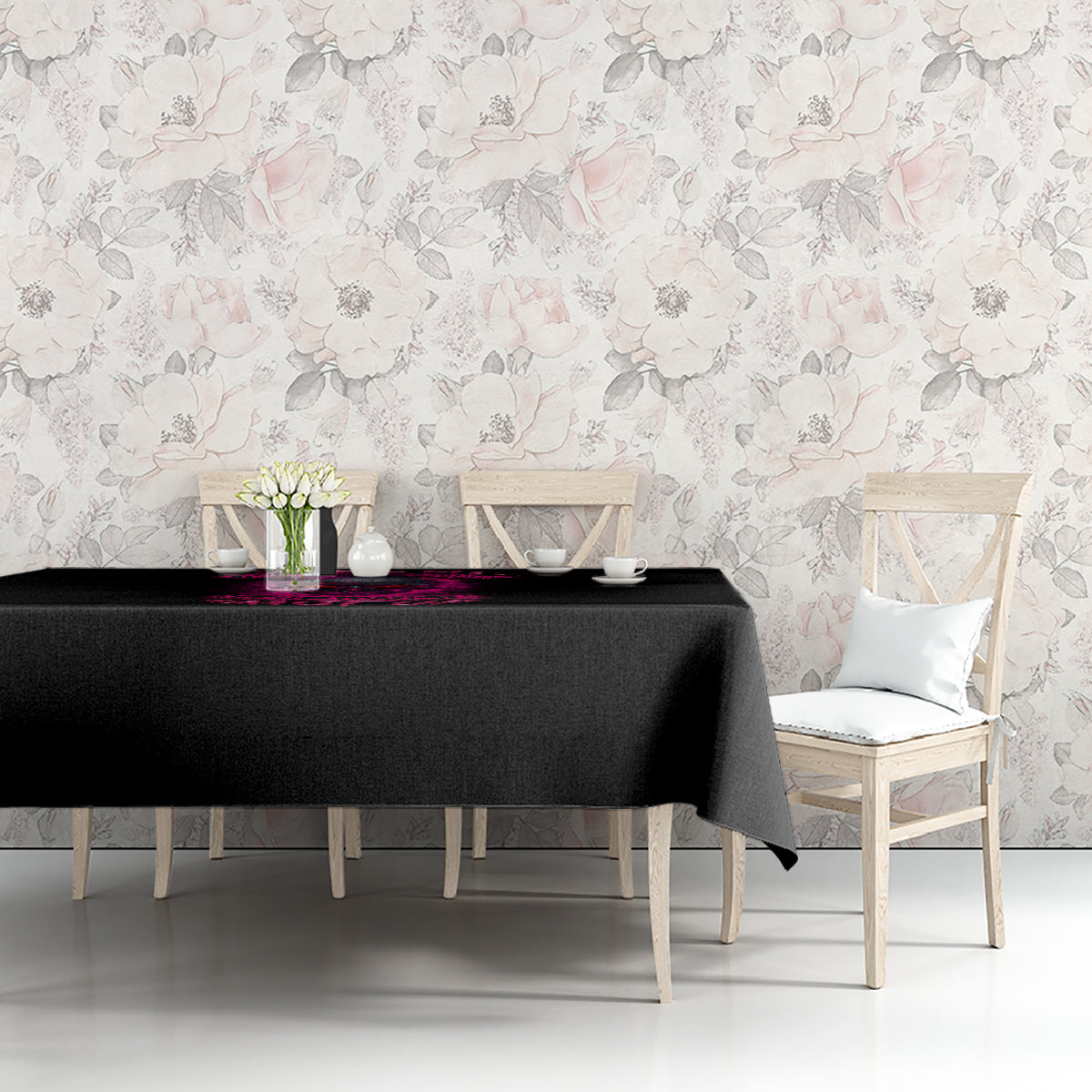 Black tablecloth on a bench table with pink printed graphic along the top