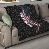 Black quilt with bowling-ball pattern, American flag graphic, and vertical team name on couch