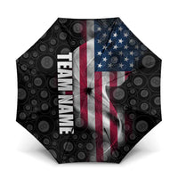 Black patterned folding umbrella with red-white-blue flag panel and vertical TEAM text