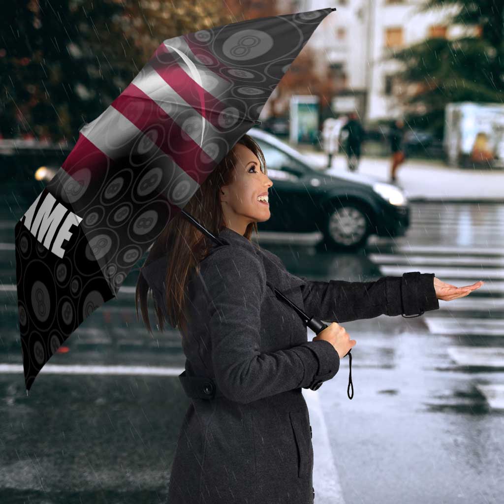 Black patterned umbrella with vertical TEAM text and American flag stripe panel