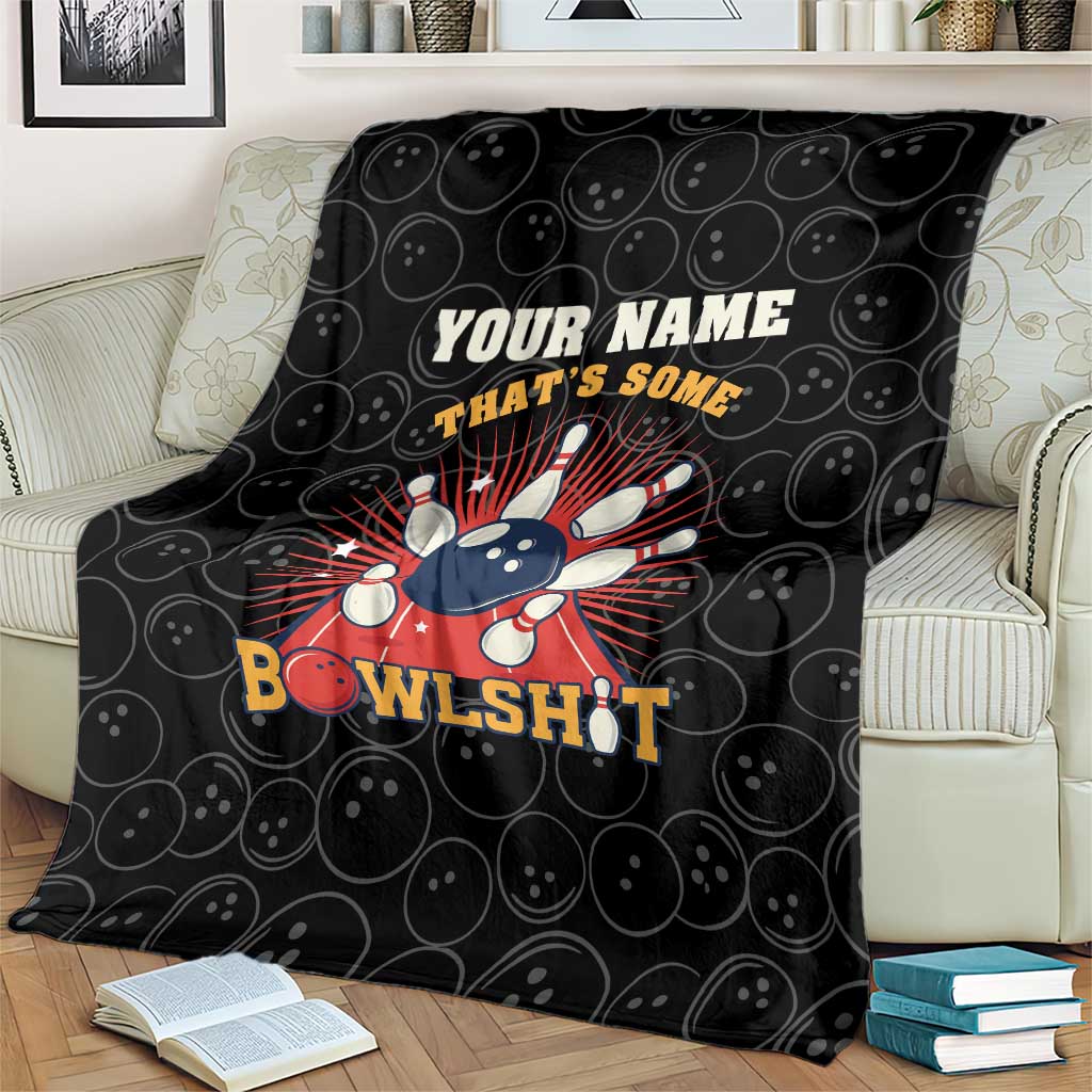 Black bowling blanket on couch with bowling pin strike burst and 'BowlsHit' quote