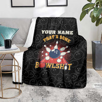 Black bowling throw blanket on floor with bowling pin graphic and 'BowlsHit' text