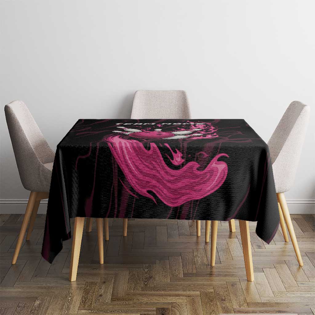 Black tablecloth with pink flame swirl graphic on small dining table