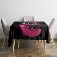 Black tablecloth with pink flame swirl graphic on small dining table