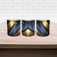 Three ceramic mugs with blue and gold bowling graphics on display