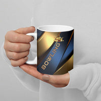 Ceramic coffee mug with blue and gold bowling graphic and crown pin