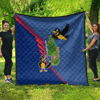 Blue quilt laid out outdoors, red stripe border with cartoon bird and island map graphic.