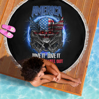 Round black beach blanket with white fringe, America skull and wings graphic, text design.