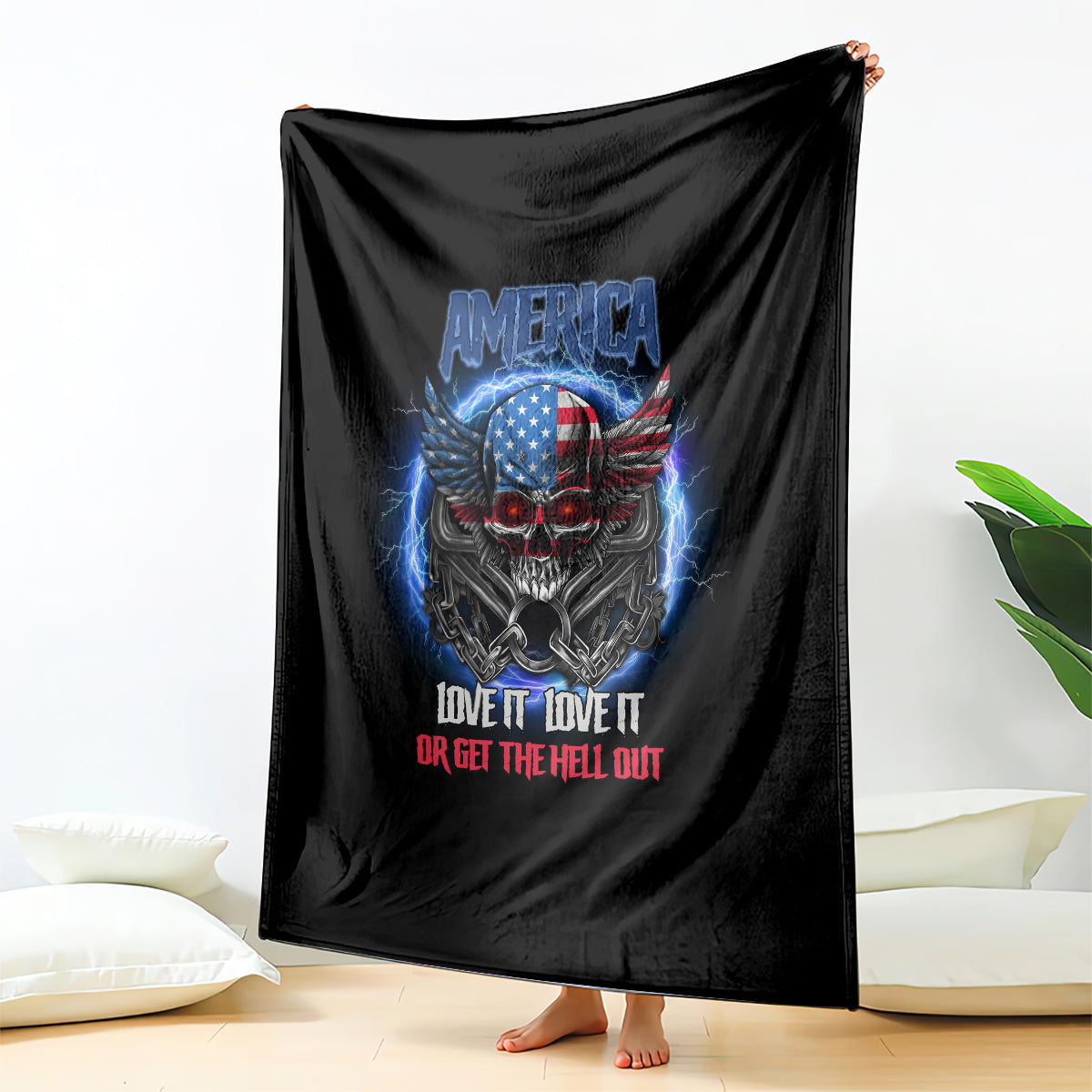 Black throw blanket draped open with America eagle skull graphic and slogan.