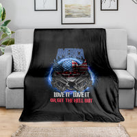 Black throw blanket with blue and red eagle skull graphic and patriotic slogan.
