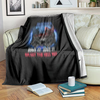 Black throw blanket with blue and red distressed eagle skull and slogan.