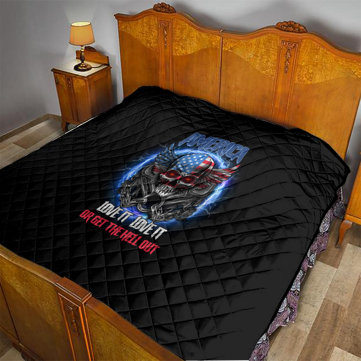 Black quilt with diamond quilting and patriotic skull graphic on bed