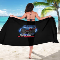 Black printed sarong with America skull graphic, draped for coverage