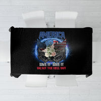 Folded black tablecloth showing America crest graphic with blue light effects