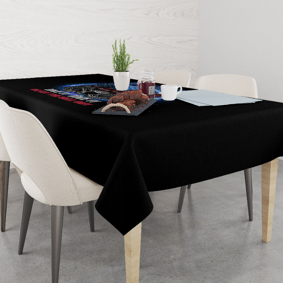 Black tablecloth draped over dining table with America graphic and decorative centerpiece