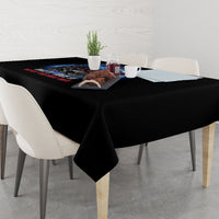 Black tablecloth draped over dining table with America graphic and decorative centerpiece