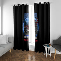 Black curtain panels with blue-red eagle skull graphic and slogan centered on window