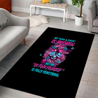 Black rectangular area rug with colorful neon skull graphic and slogan text