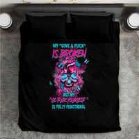 Black bedding set with two pillowcases, colorful skull graphic centered on duvet