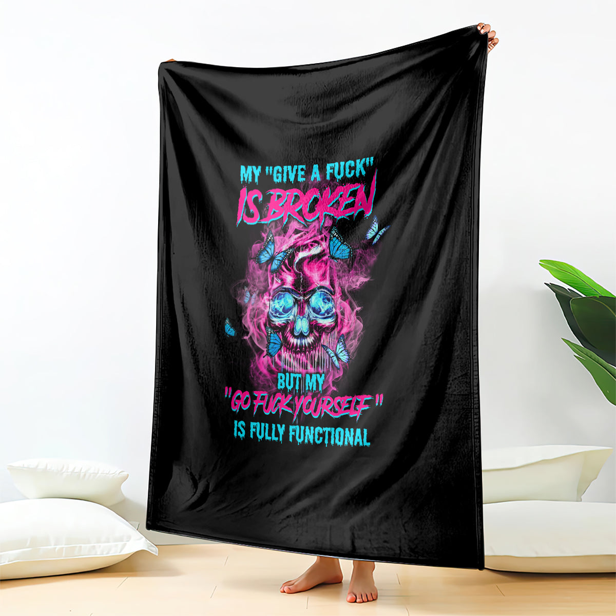 Black fleece blanket with vivid skull print and colorful statement typography