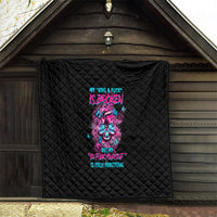 Black quilt hanging display, neon skull and text graphic, quilted diamond pattern