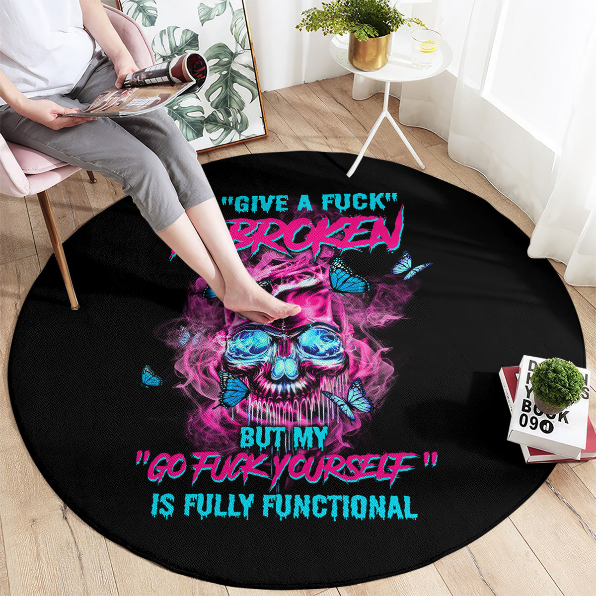 Black round carpet with neon skull graphic and 'GO FUCK YOURSELF' slogan text