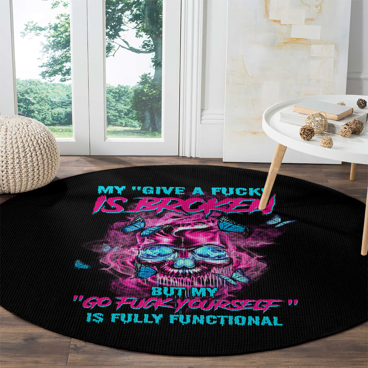 Black round carpet with neon skull graphic and slogan text, 'GO FUCK YOURSELF'