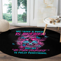 Black round carpet with neon skull graphic and slogan text, 'GO FUCK YOURSELF'