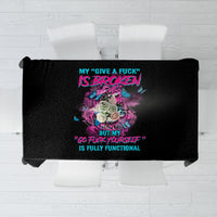 Black tablecloth with colorful graphic print, spread flat top view