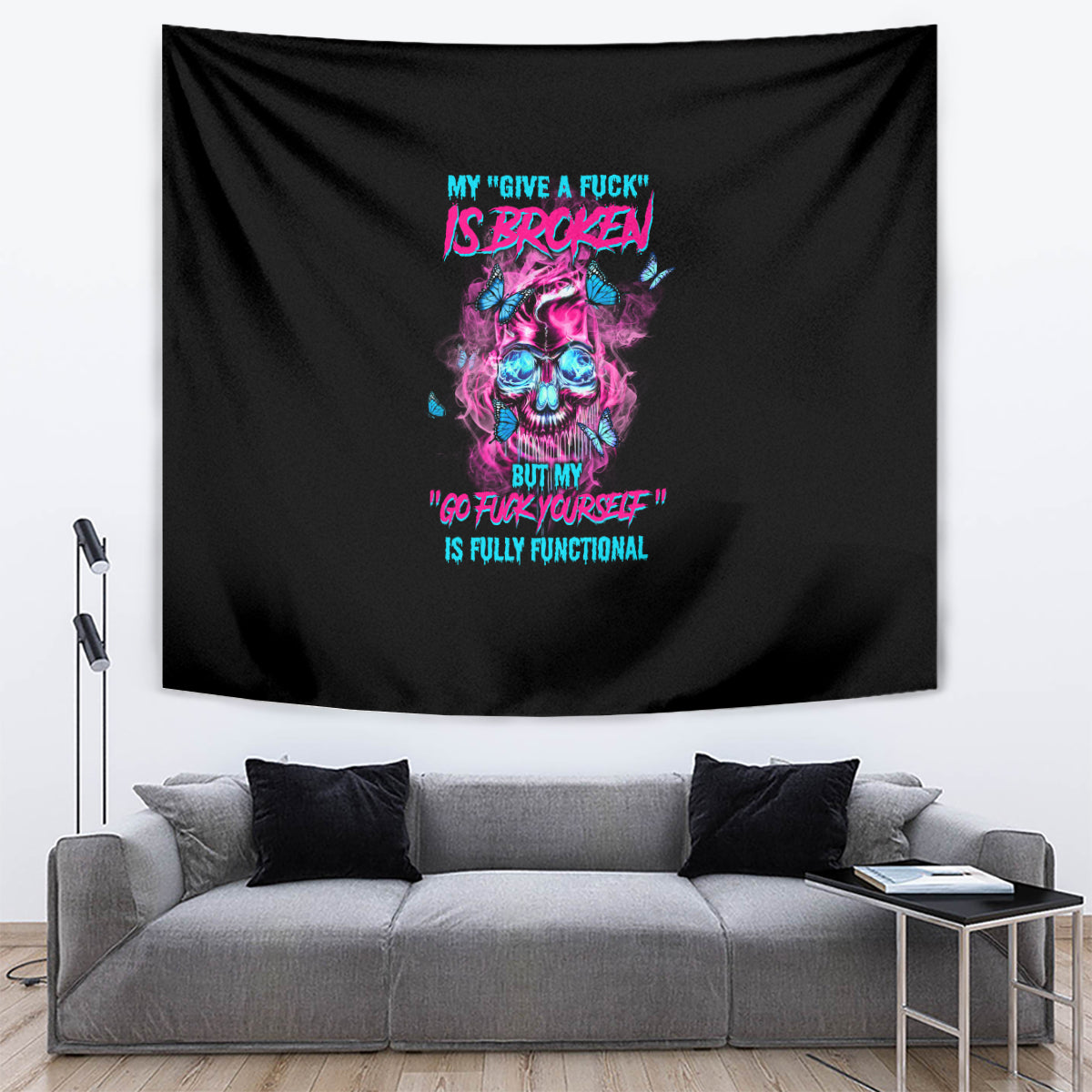 Black tapestry with neon skull graphic and colorful quote text, visible folds