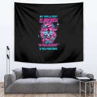 Black tapestry with neon skull graphic and colorful quote text, visible folds