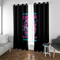 Black window curtains with vertical colorful skull artwork on two hanging panels