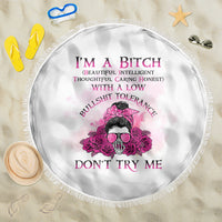Round beach blanket in white with pink rose skull graphic and tassel fringe edges