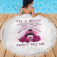 Round beach blanket in white with pink rose skull graphic and tassel fringe