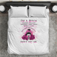 White duvet cover with pink skull-and-flowers graphic and two front pillowcases