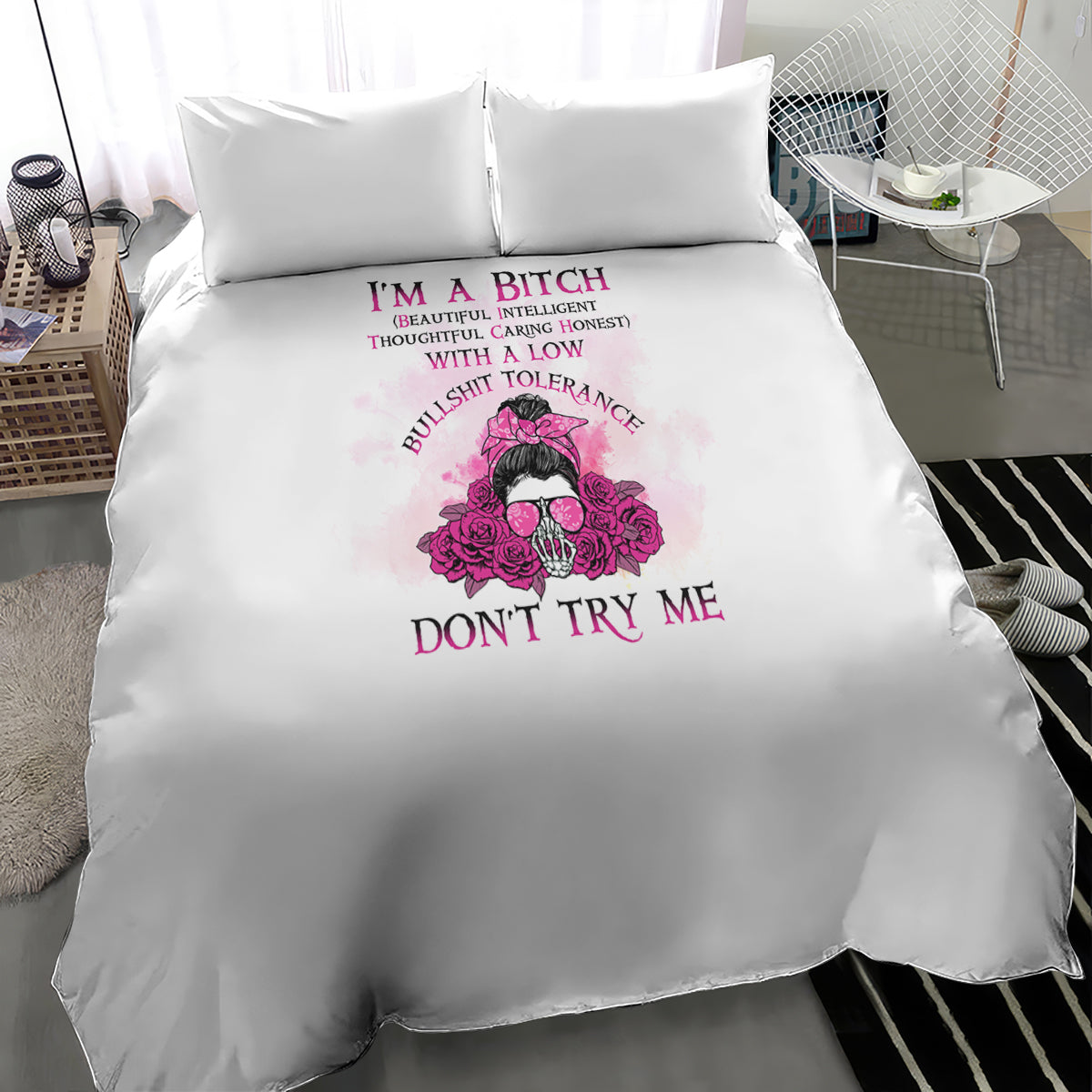 White duvet cover with pink skull-and-flowers graphic and bold 'DON'T TRY ME' text, two pillows