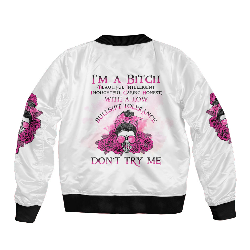 White unisex bomber jacket with back text and central skull with pink roses