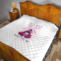 White quilt with diamond quilting and pink rose graphic and quote text for statement.