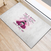 Light gray doormat with purple rose-and-woman graphic and “DON'T TRY ME” text