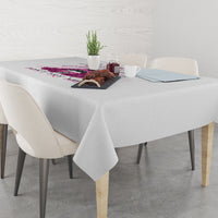 Gray tablecloth with multicolor rose and text graphic across the tabletop edge