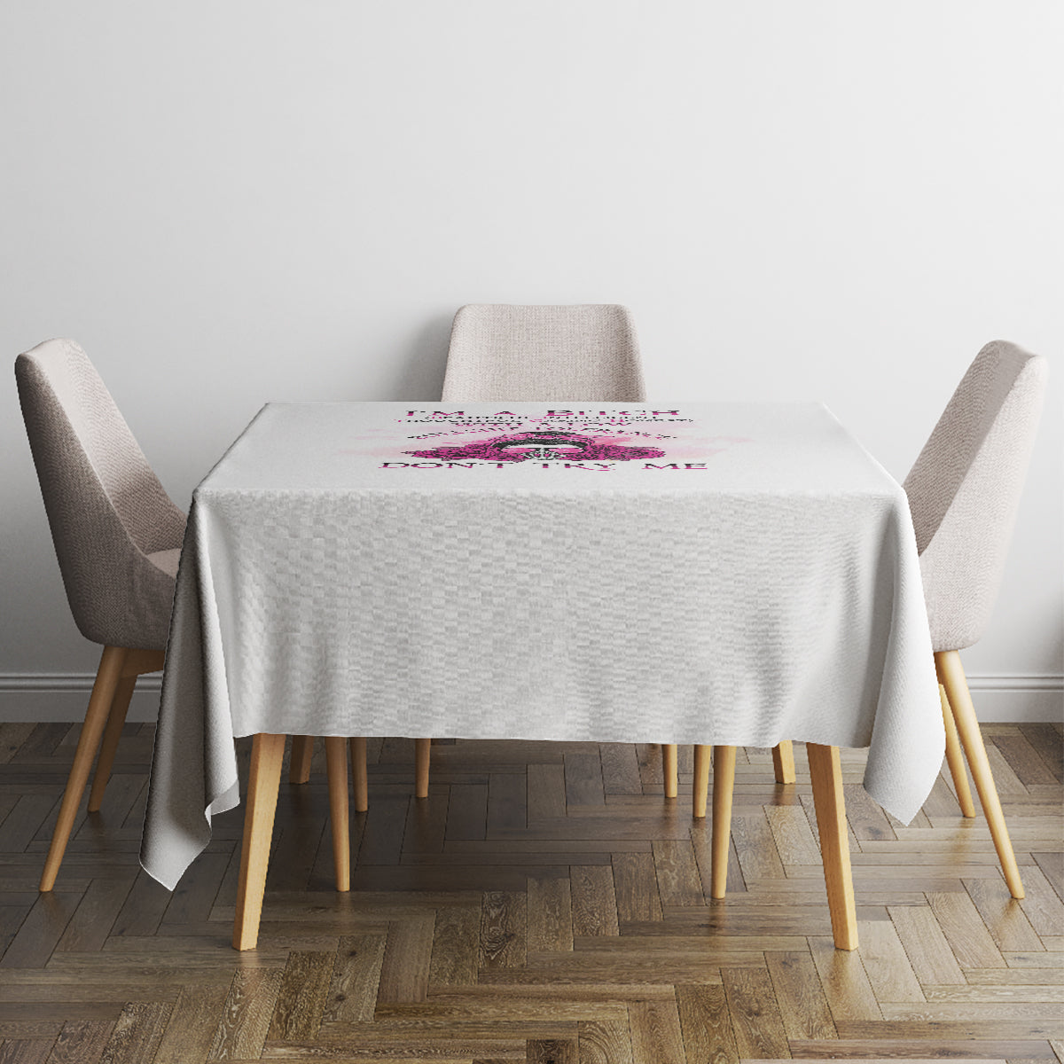 White tablecloth with small multicolor rose and text graphic near the center