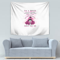 White tapestry with pink “I'M A BITCH” lettering and floral skull graphic