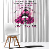 White window curtain with vertical pink rose graphic and bold magenta text panels