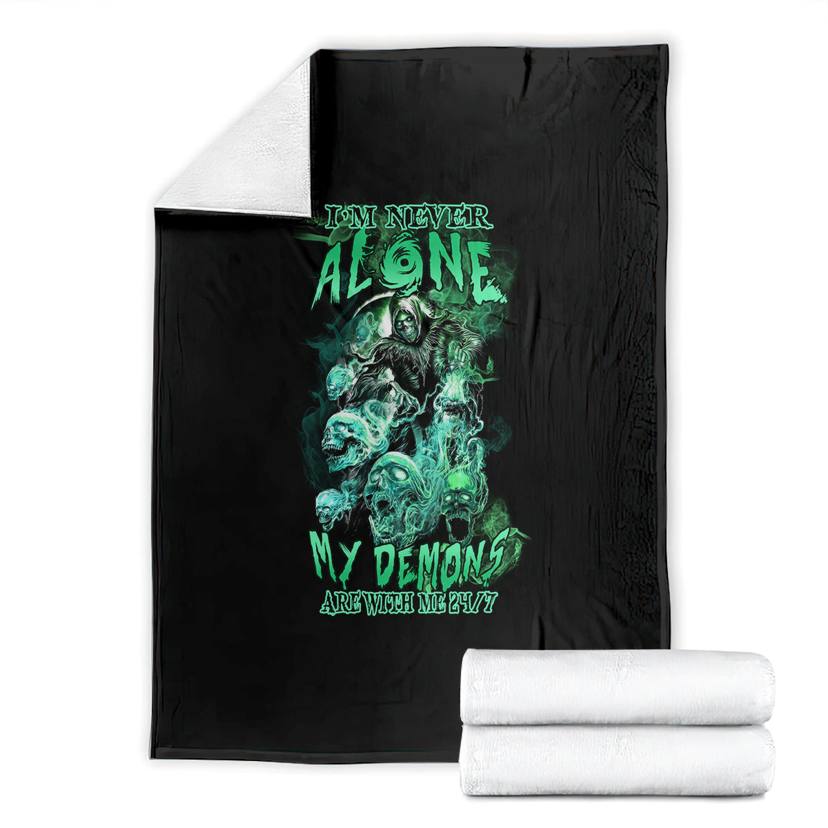 Black reaper skull blanket with teal-green artwork, shown with folded stacks