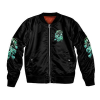Black satin bomber jacket with front zipper and turquoise skull graphic on chest, sleeves