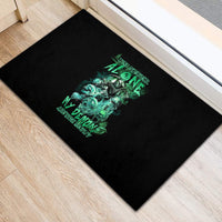 Black rubber doormat with green skull reaper graphic and warning-style text