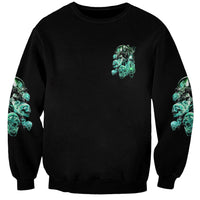 Black crewneck sweatshirt with teal skull-and-smoke reaper graphic on chest