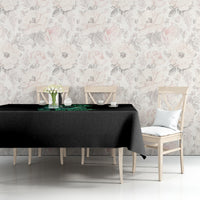 Black tablecloth with green reaper graphic and smooth drape over the dining table