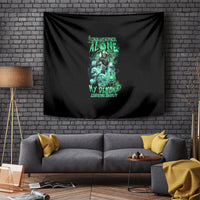 Black tapestry with teal-green skull reaper and glowing lettering, centered