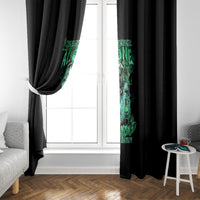 Black window curtains with green skull reaper print on each side panel